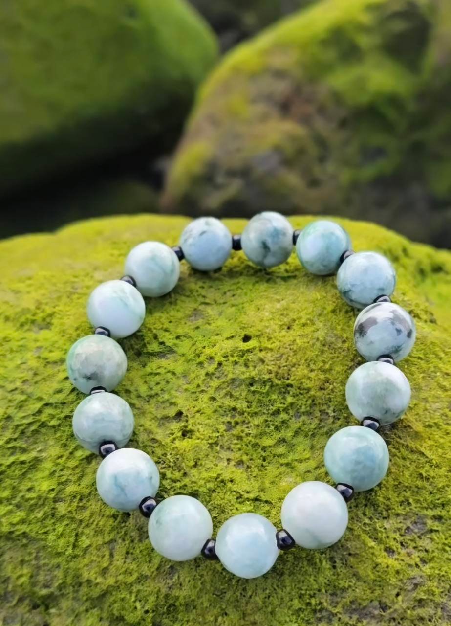 TEIVARA bracelet on a moss-covered volcanic stone
